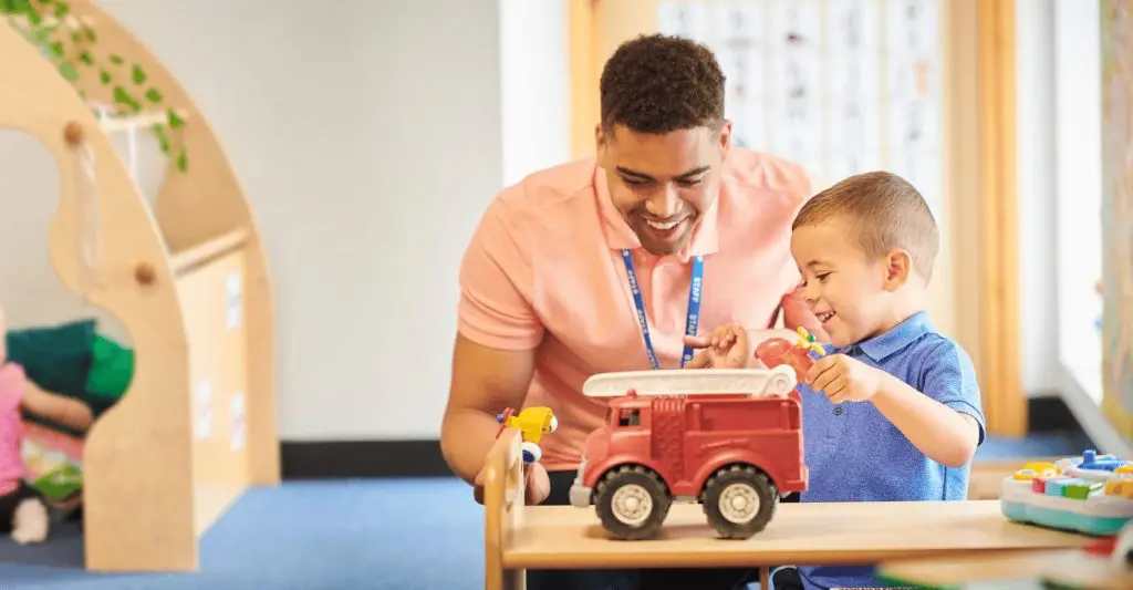 Early childhood educator engaging with kid